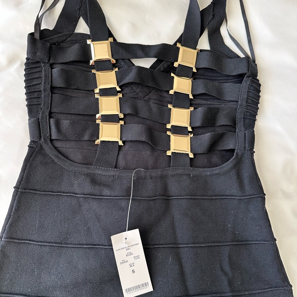 New with tags, black bandage, Bebe dress with gold detailing on the back